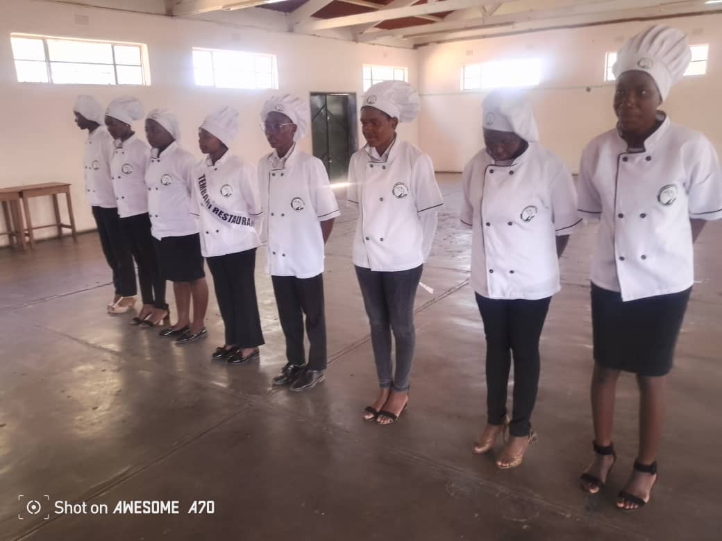Catering students in professional chef uniforms